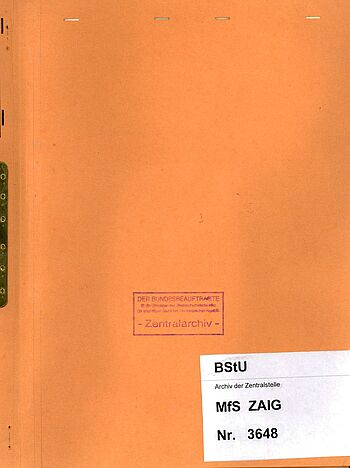 Orangefarbener  Aktendeckel mit Beschriftung ZAIG